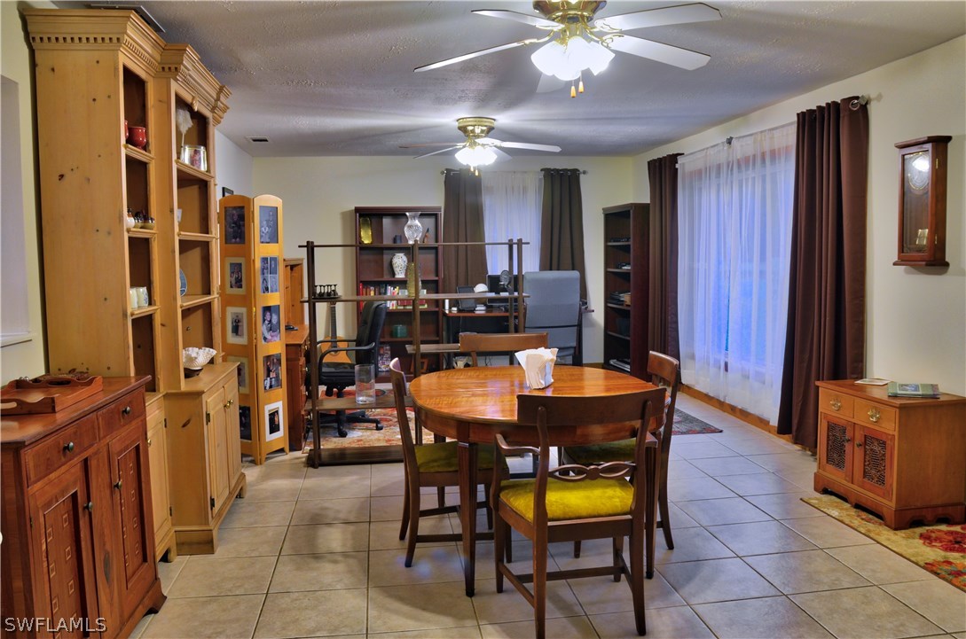23081 North River Road Alva, FL 33920 - Photo 8 of 25 a view of a dining room with furniture