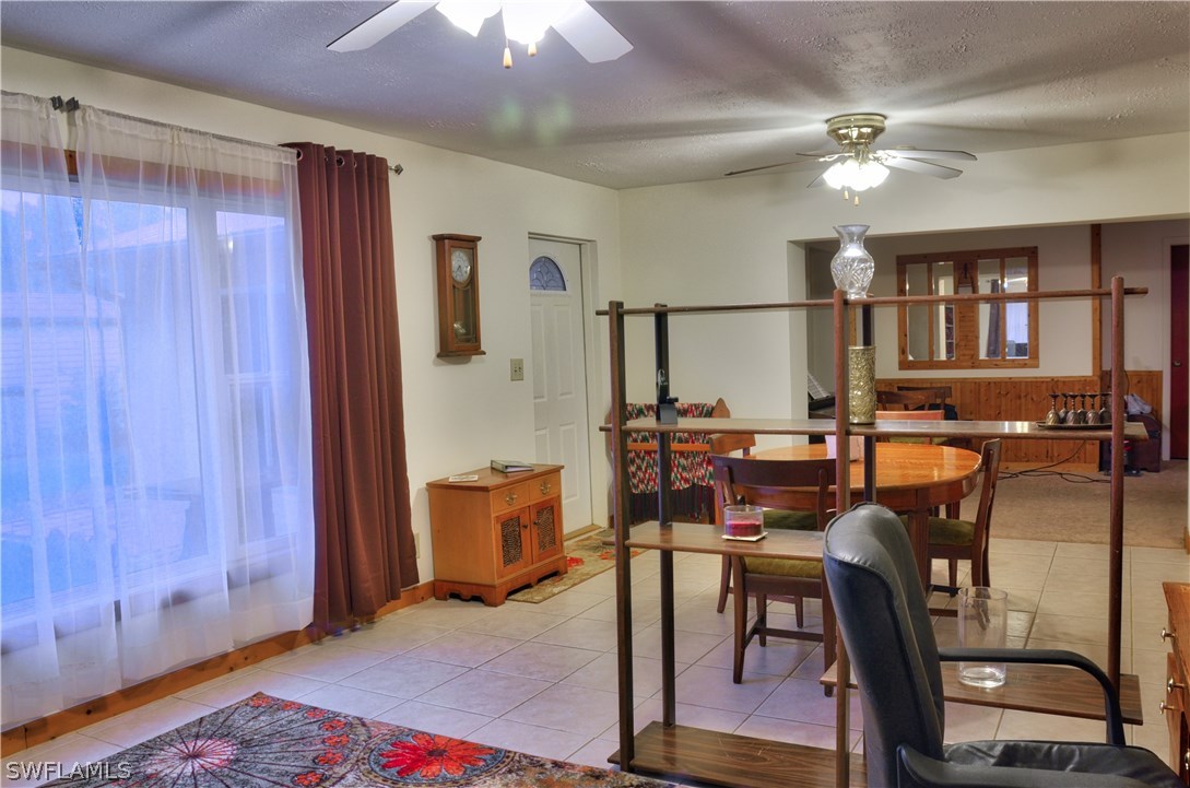 23081 North River Road Alva, FL 33920 - Photo 9 of 25 a view of a livingroom with furniture and window