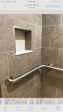 a picture of a bathroom with a shower