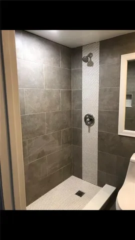 a bathroom with a sink and a shower