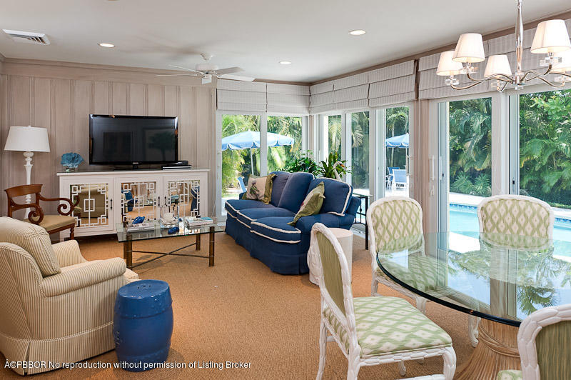 304 Plantation Road Palm Beach, FL 33480 - Photo 5 of 10 a living room with furniture tv and a large window