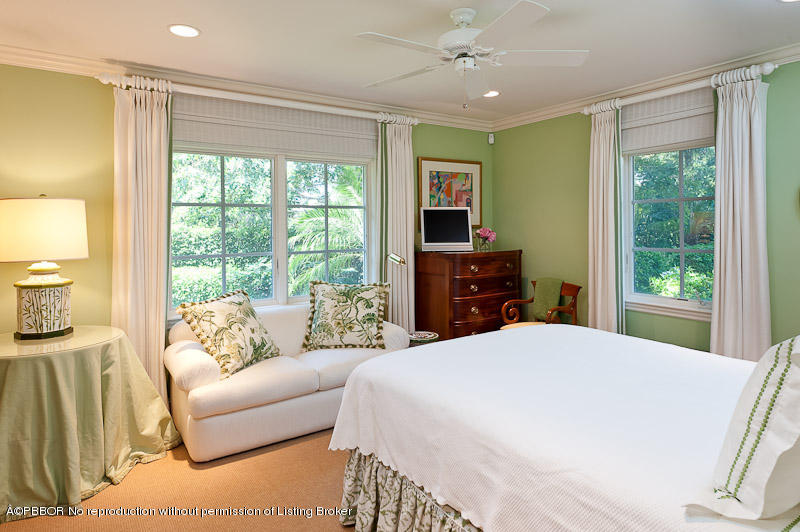 304 Plantation Road Palm Beach, FL 33480 - Photo 9 of 10 a bedroom with a bed and large windows