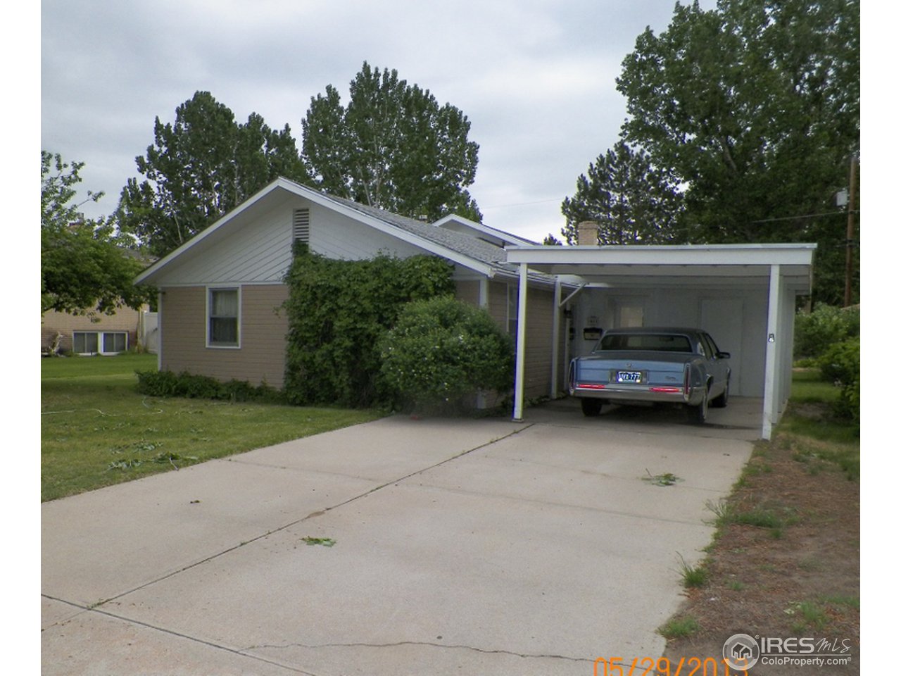 411 Ray Street Brush, CO 80723 - Photo 1 of 6 a house view with a garden space