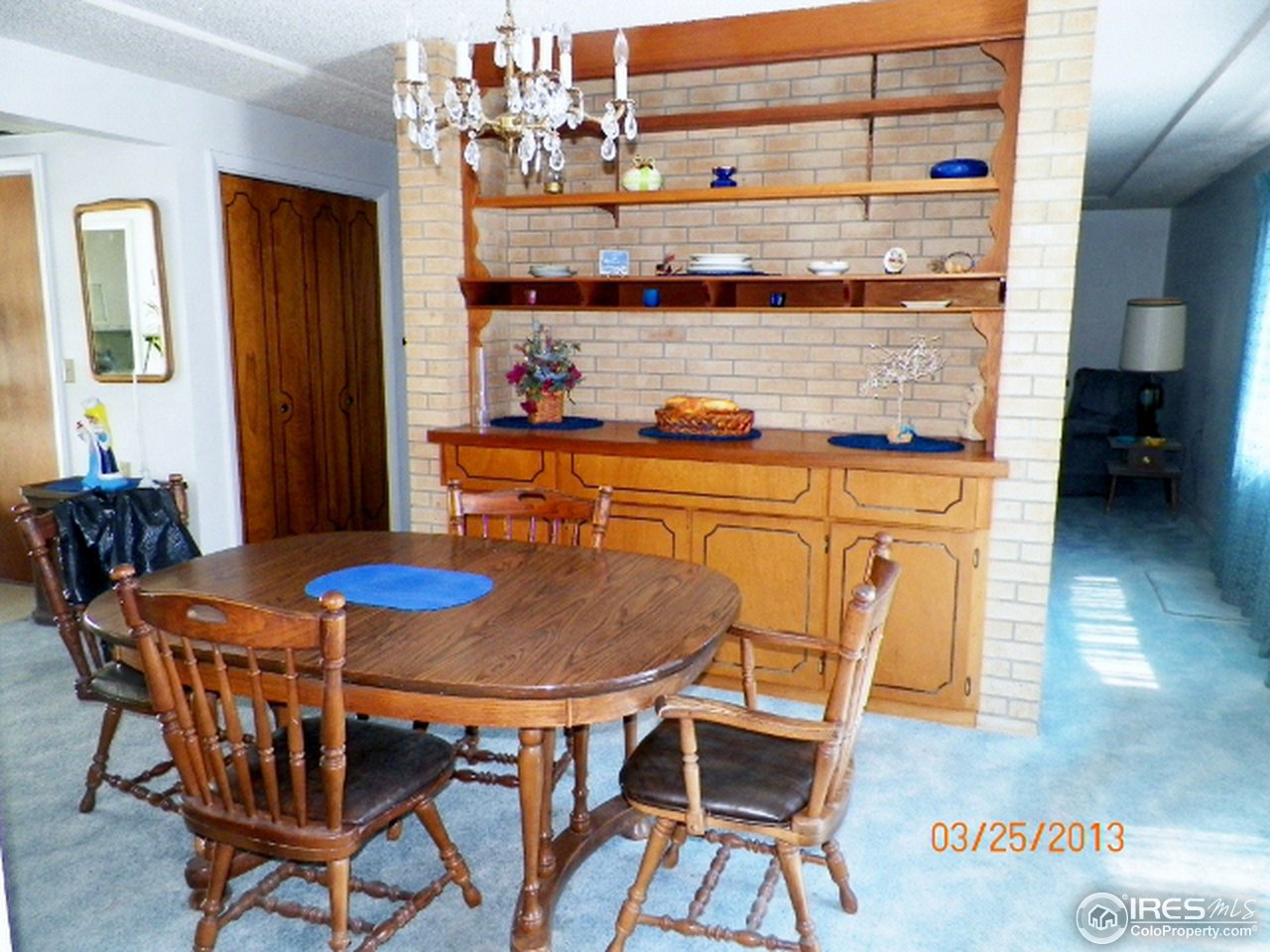 411 Ray Street Brush, CO 80723 - Photo 2 of 6 a dining room with a wooden table and chairs