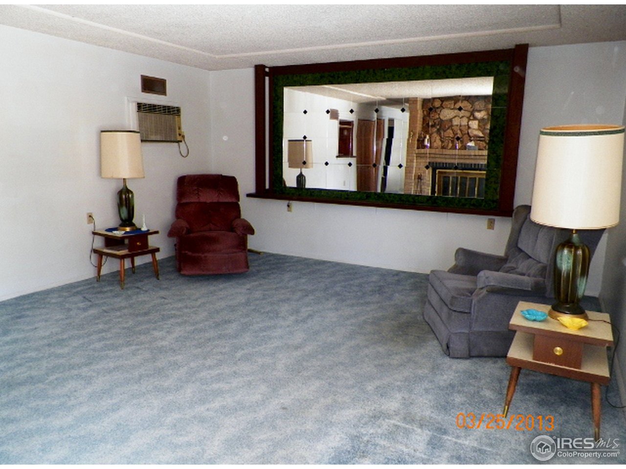 411 Ray Street Brush, CO 80723 - Photo 4 of 6 a living room with furniture and a fireplace