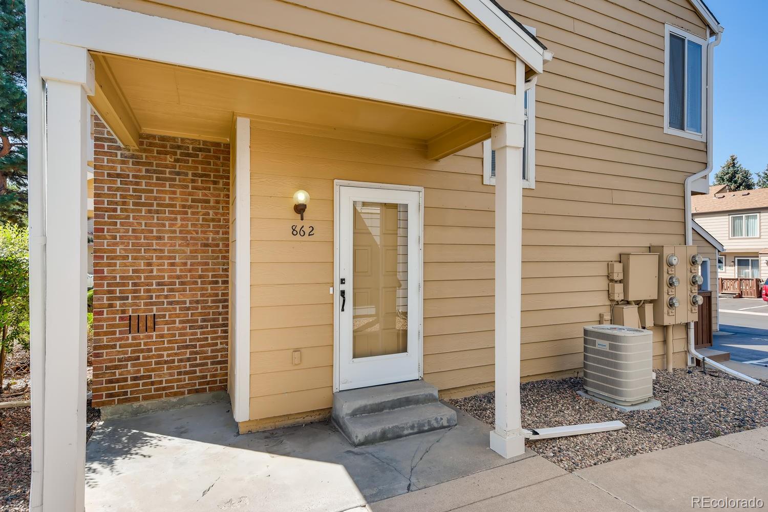 862 Summer Drive Highlands Ranch, CO 80126 - Photo 1 of 21 a view of a wooden door of the house