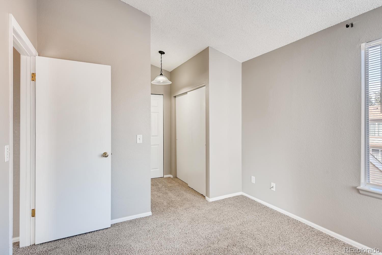 862 Summer Drive Highlands Ranch, CO 80126 - Photo 17 of 21 a view of an empty room with a window