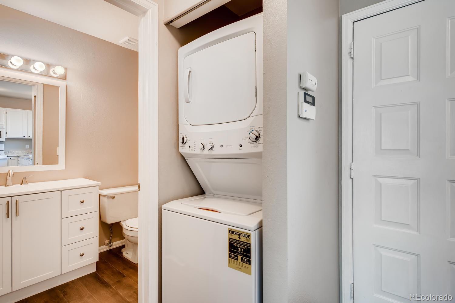 862 Summer Drive Highlands Ranch, CO 80126 - Photo 19 of 21 a utility room with dryer and washer