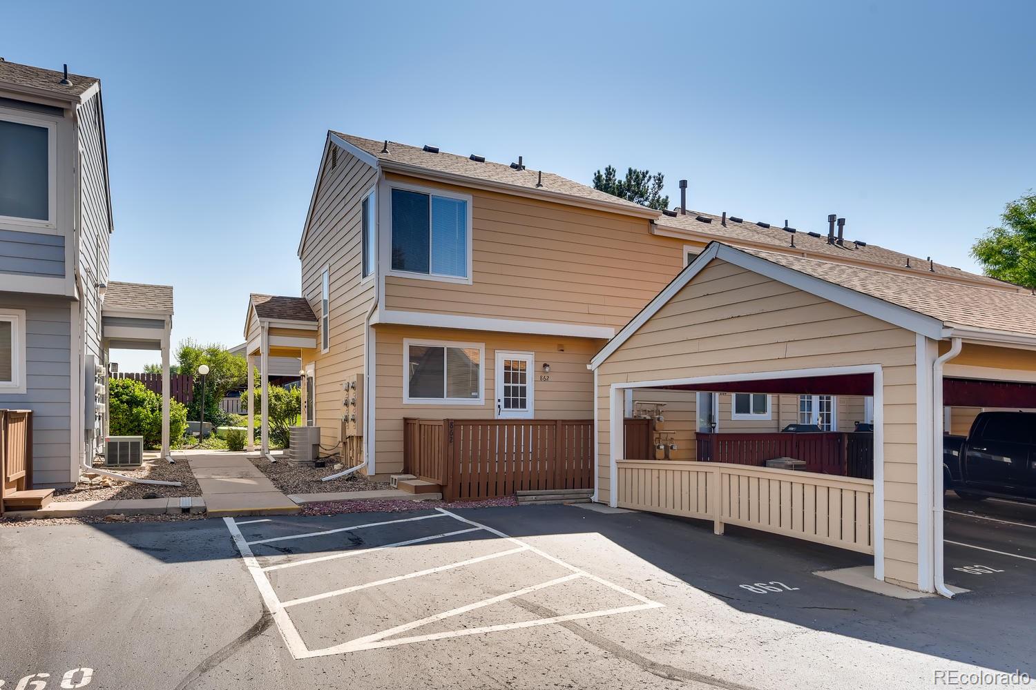 862 Summer Drive Highlands Ranch, CO 80126 - Photo 20 of 21 a view of a house with a balcony and porch