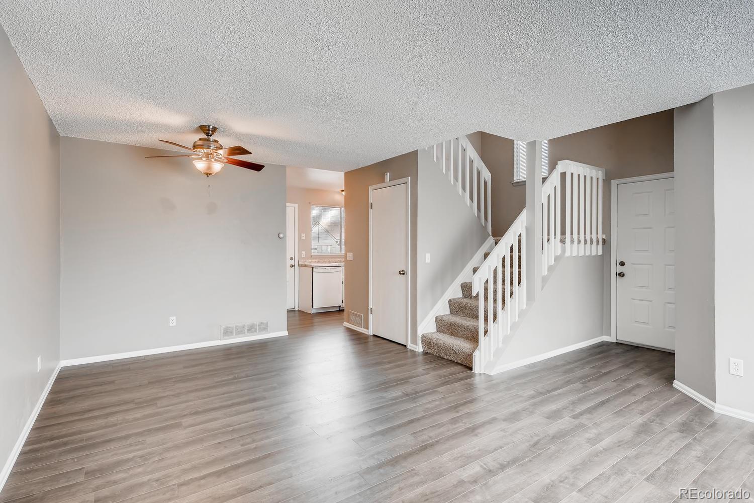 862 Summer Drive Highlands Ranch, CO 80126 - Photo 6 of 21 a view of an entryway with wooden floor