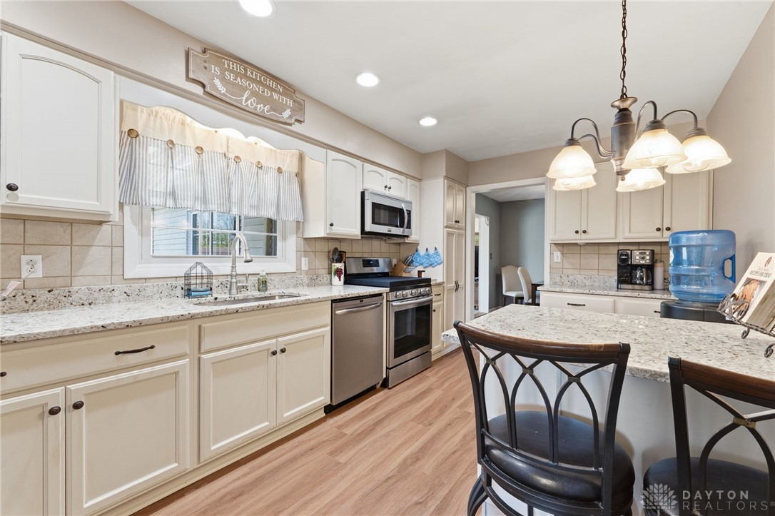 2945 Ashlar Drive Springfield, OH 45503 - Photo 5 of 20 This kitchen offers stylish countertops, modern appliances, and a welcoming layout perfect for everyday living.