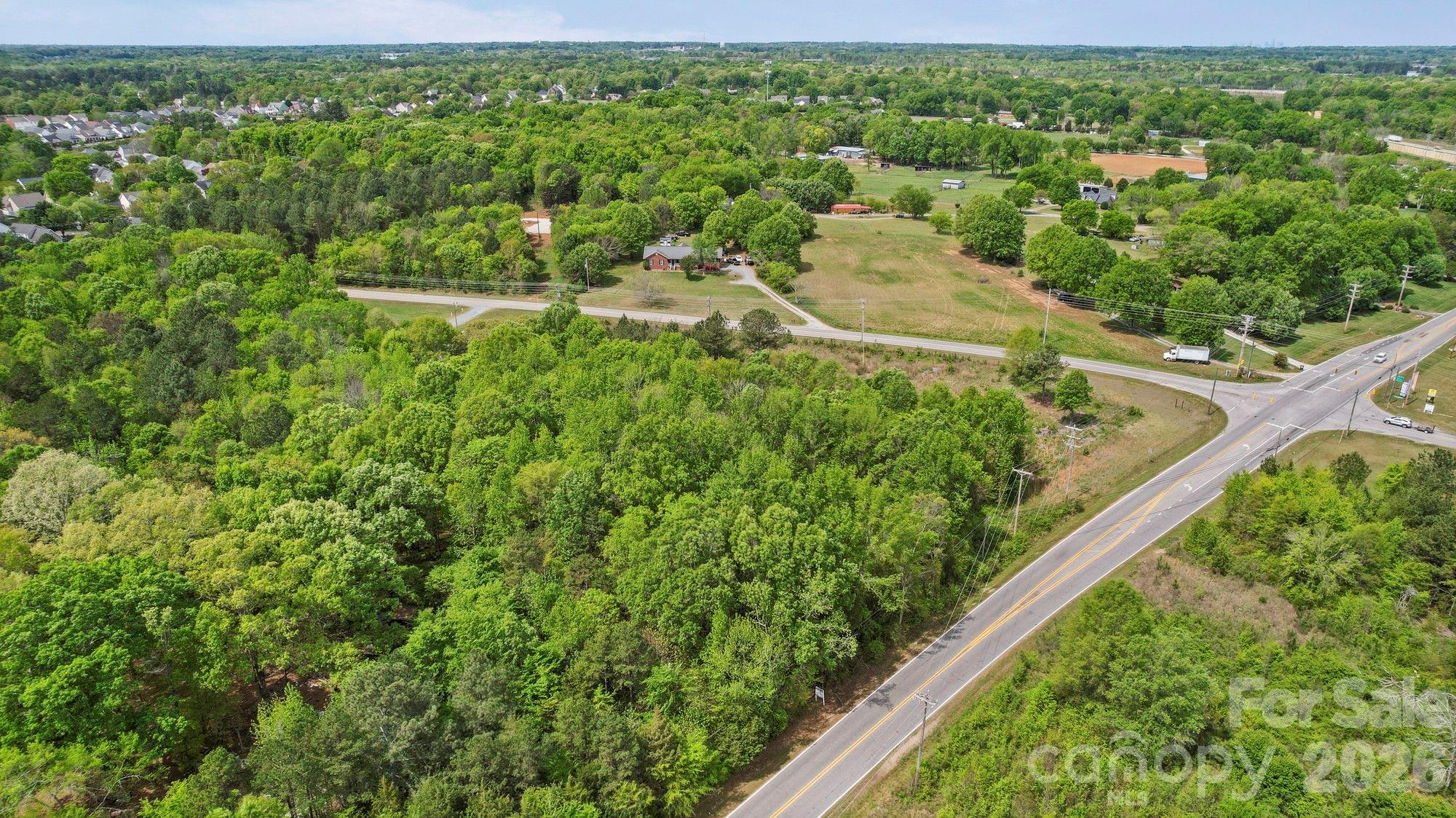 0 Faith Church Road Indian Trail, NC 28079 - Photo 18 of 21 a view of a yard with potted plants