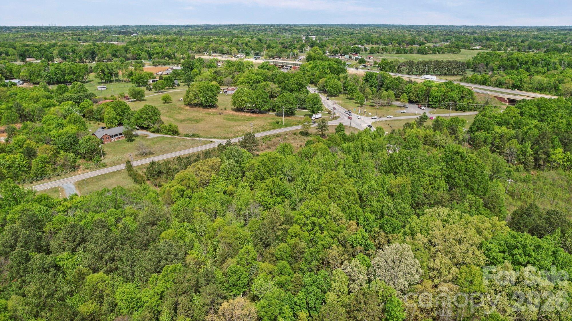 0 Faith Church Road Indian Trail, NC 28079 - Photo 20 of 21 a view of a green field with lots of bushes
