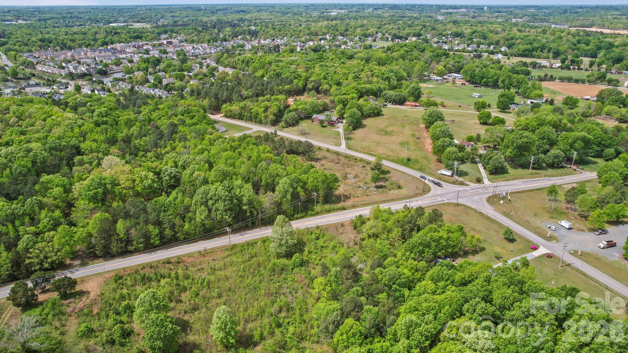 0 Faith Church Road Indian Trail, NC 28079 - Photo 10 of 21 a view of a city with lush green forest