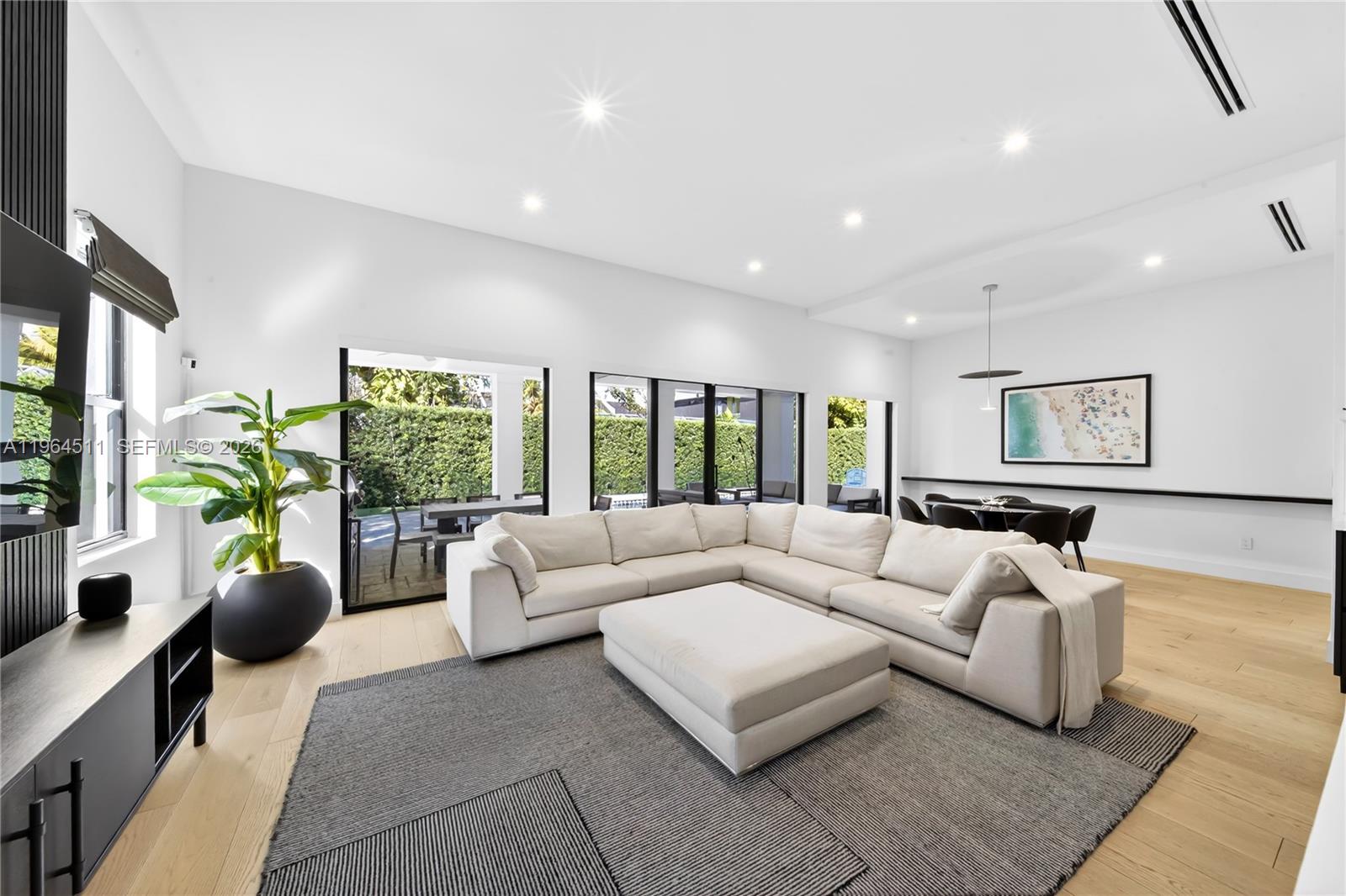 7500 Southwest 55th Avenue Miami, FL 33143 - Photo 13 of 48 a living room with furniture and a potted plant