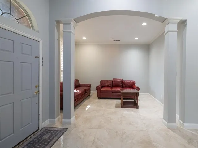 a living room with furniture and a rug