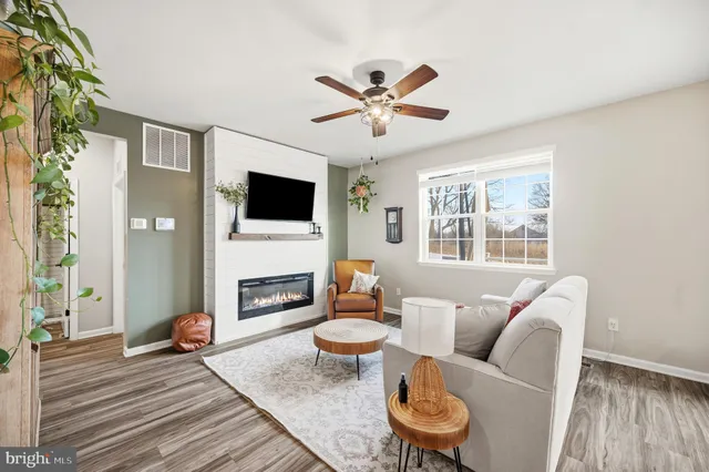 a bedroom with bed tv and window