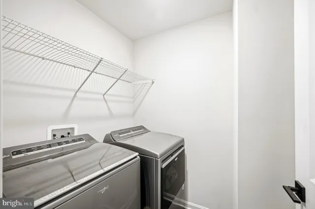 a spacious bedroom with a bed and a window