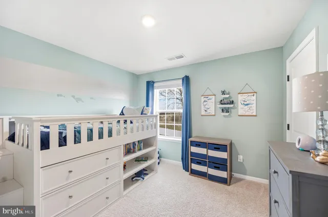 a view of a chair and table on the wooden floor