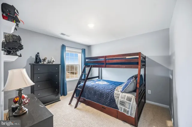 a bathroom with a toilet and a bathtub
