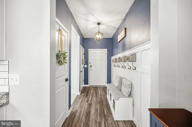 a dining room with furniture a livingroom with wooden floor