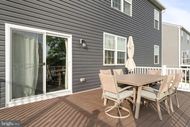 a view of a balcony with wooden fence