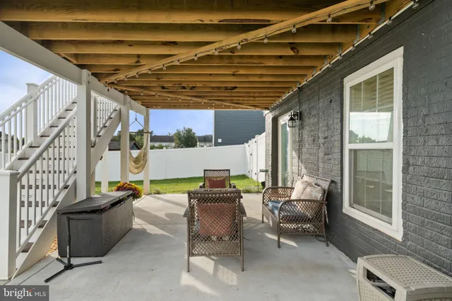an aerial view of a house with swimming pool and big yard