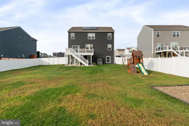 an aerial view of a house with a garden
