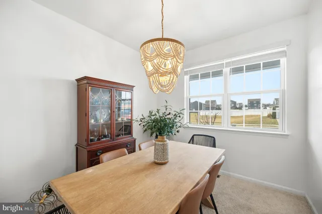 a kitchen with a refrigerator and a stove top oven