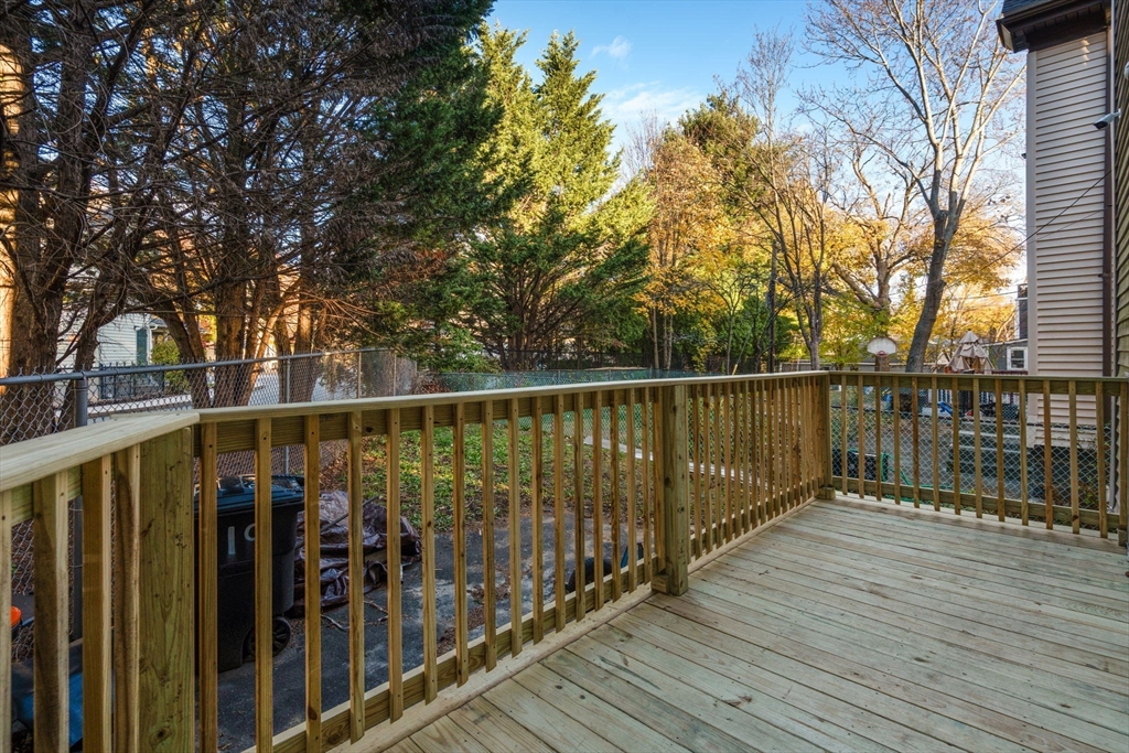 19 Carmen Street, Unit 2 Boston, MA 02121 - Photo 13 of 18 a balcony with wooden floor and outdoor space