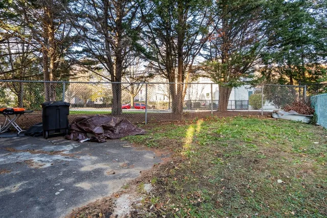 a view of a yard with furniture in front of the house