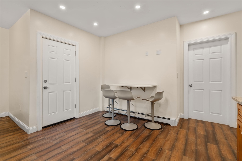 19 Carmen Street, Unit 2 Boston, MA 02121 - Photo 8 of 18 a view of livingroom with furniture and wooden floor