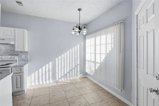 a view of a kitchen with dishwasher and a stove top oven