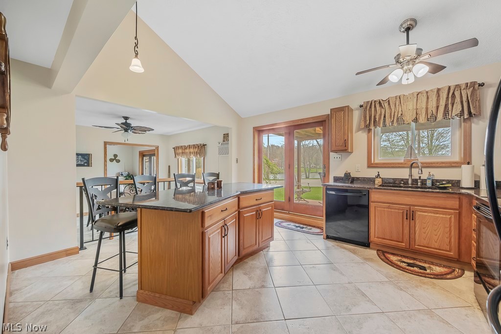 6939 Lakeview Road Hanoverton, OH 44423 - Photo 7 of 42 Kitchen with a kitchen island, ceiling fan, light ceramic tile flooring, and black dishwasher