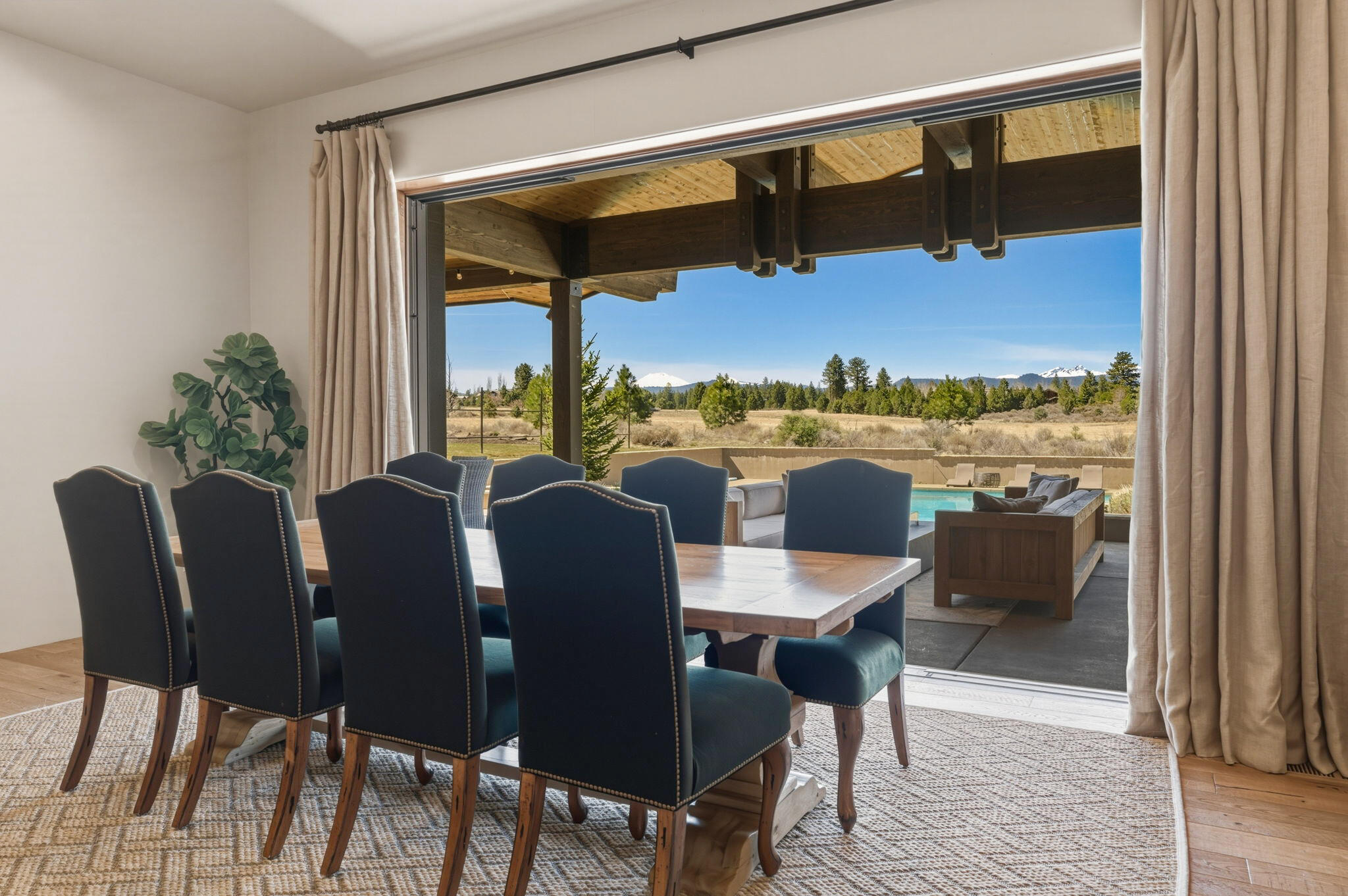 19100 Macalpine Loop Bend, OR 97702 - Photo 14 of 56 Dining room - panoramic doors to outdoor living space