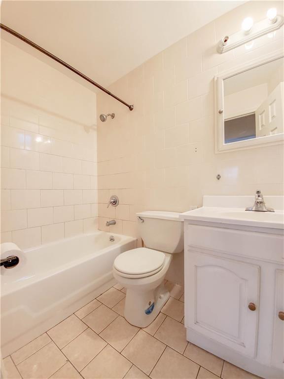1919 Bay Ridge Parkway Brooklyn, NY 11204 - Photo 6 of 6 a bathroom with a sink a toilet and shower