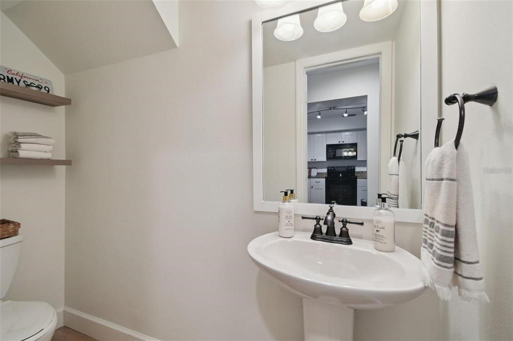 4835 West Flamingo Road Tampa, FL 33611 - Photo 16 of 51 a bathroom with a sink and a mirror