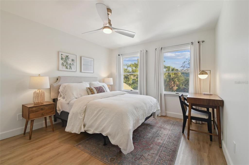 4835 West Flamingo Road Tampa, FL 33611 - Photo 27 of 51 a spacious bedroom with a bed and a table