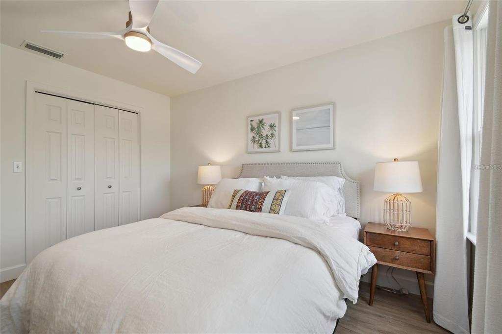 4835 West Flamingo Road Tampa, FL 33611 - Photo 29 of 51 a large white bed in a white room