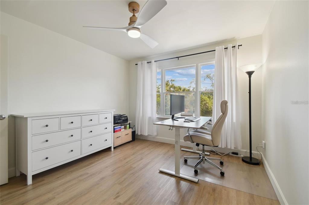 4835 West Flamingo Road Tampa, FL 33611 - Photo 31 of 51 a view of a workspace with furniture and a window