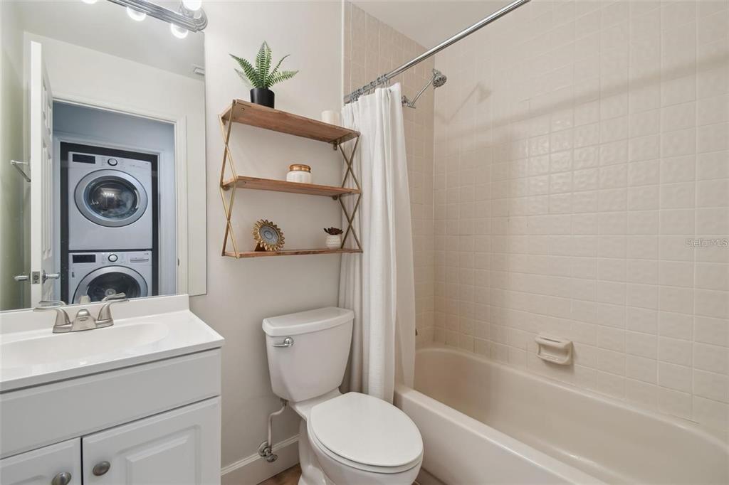 4835 West Flamingo Road Tampa, FL 33611 - Photo 32 of 51 a bathroom with a sink a toilet and shower