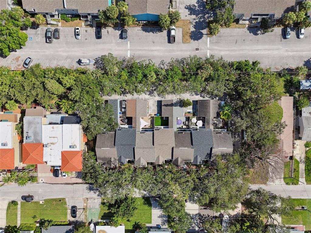 4835 West Flamingo Road Tampa, FL 33611 - Photo 48 of 51 an aerial view of a house with a garden and lake view