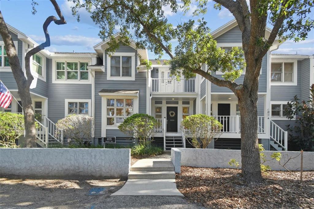 4835 West Flamingo Road Tampa, FL 33611 - Photo 49 of 51 a front view of a house with a yard