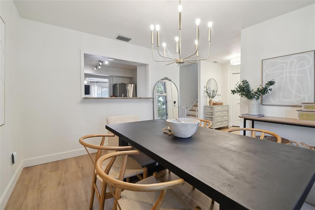 4835 West Flamingo Road Tampa, FL 33611 - Photo 8 of 51 a kitchen with a table and chairs in it