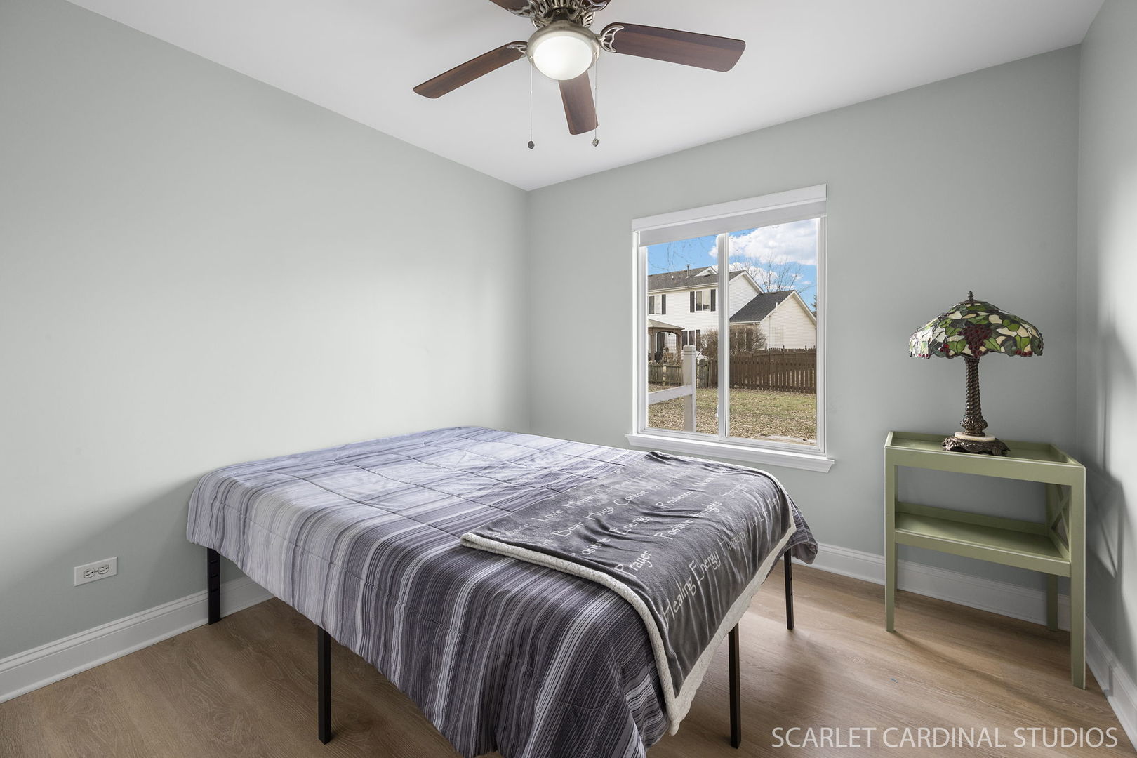 2828 Bluewater Circle Naperville, IL 60564 - Photo 15 of 17 a bedroom with a bed and a chandelier