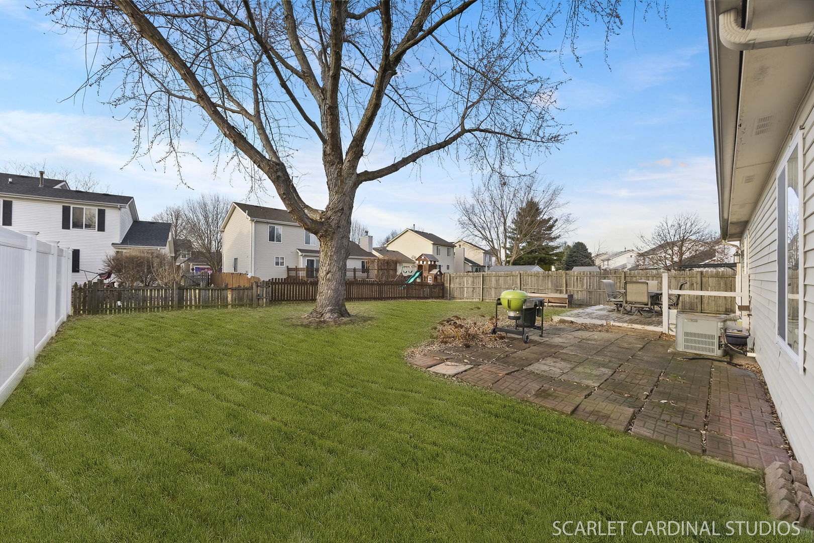 2828 Bluewater Circle Naperville, IL 60564 - Photo 16 of 17 a view of a backyard with table and chairs and a fire pit