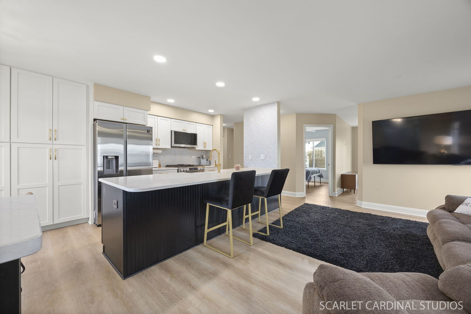 2828 Bluewater Circle Naperville, IL 60564 - Photo 2 of 17 a living room with furniture and a flat screen tv