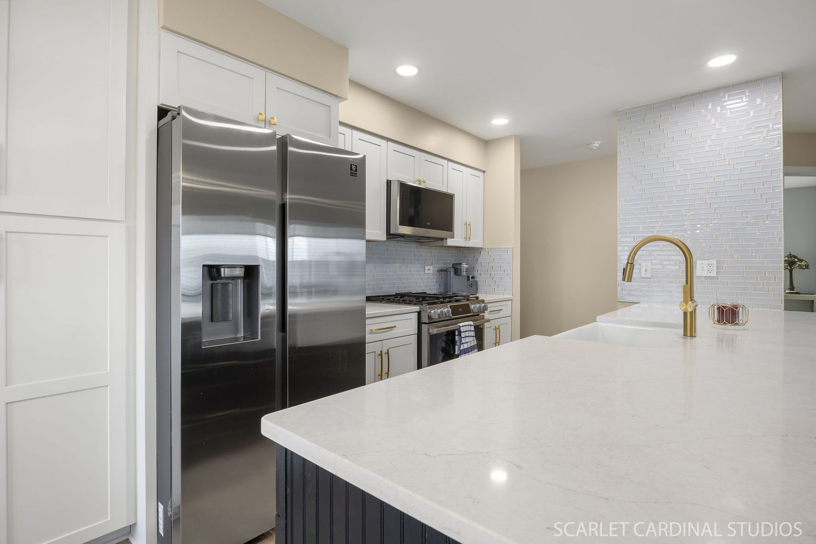 2828 Bluewater Circle Naperville, IL 60564 - Photo 3 of 17 a kitchen with stainless steel appliances kitchen island granite countertop a refrigerator a stove a sink and a refrigerator