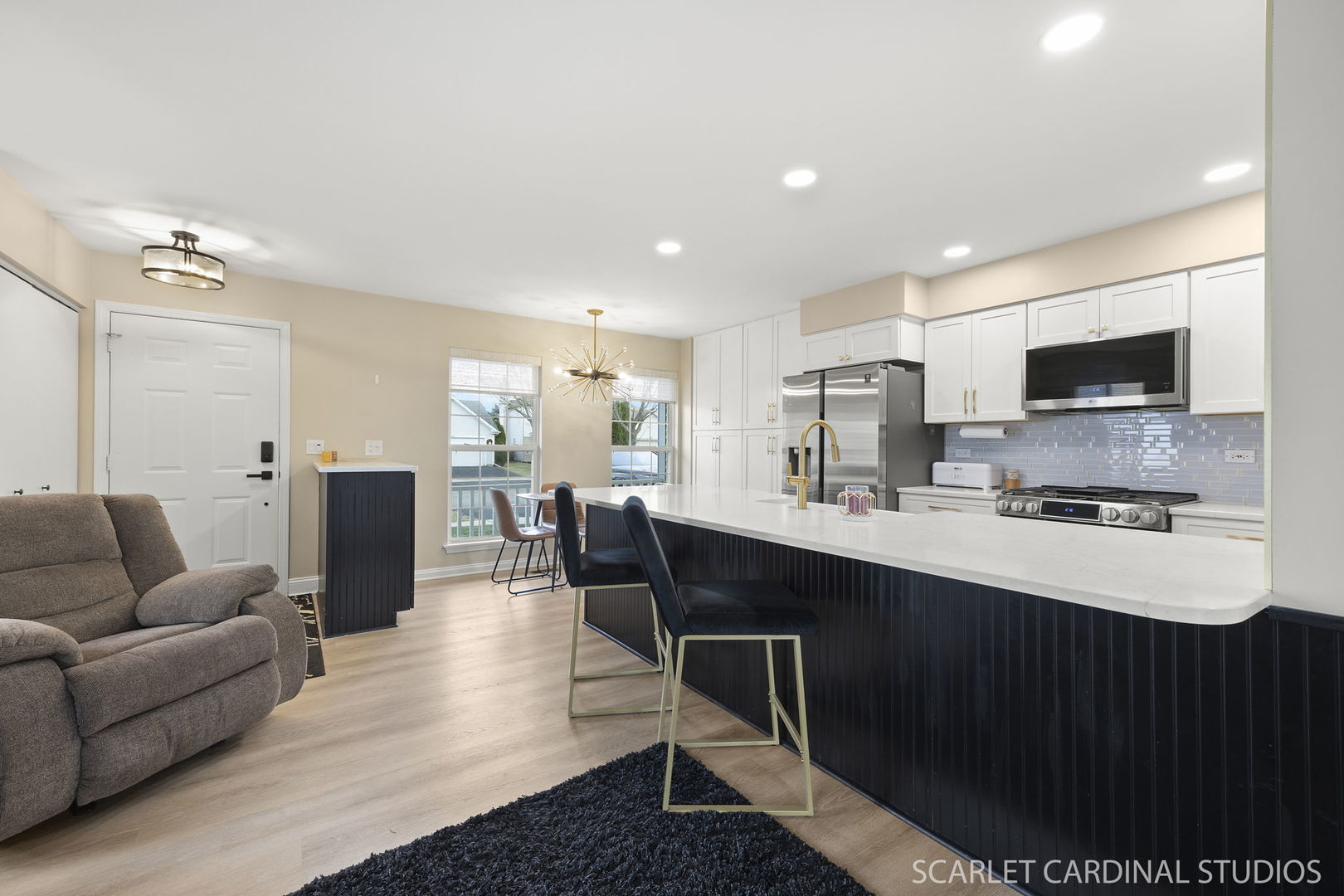 2828 Bluewater Circle Naperville, IL 60564 - Photo 6 of 17 a living room with stainless steel appliances kitchen island granite countertop a couch and a view of living room