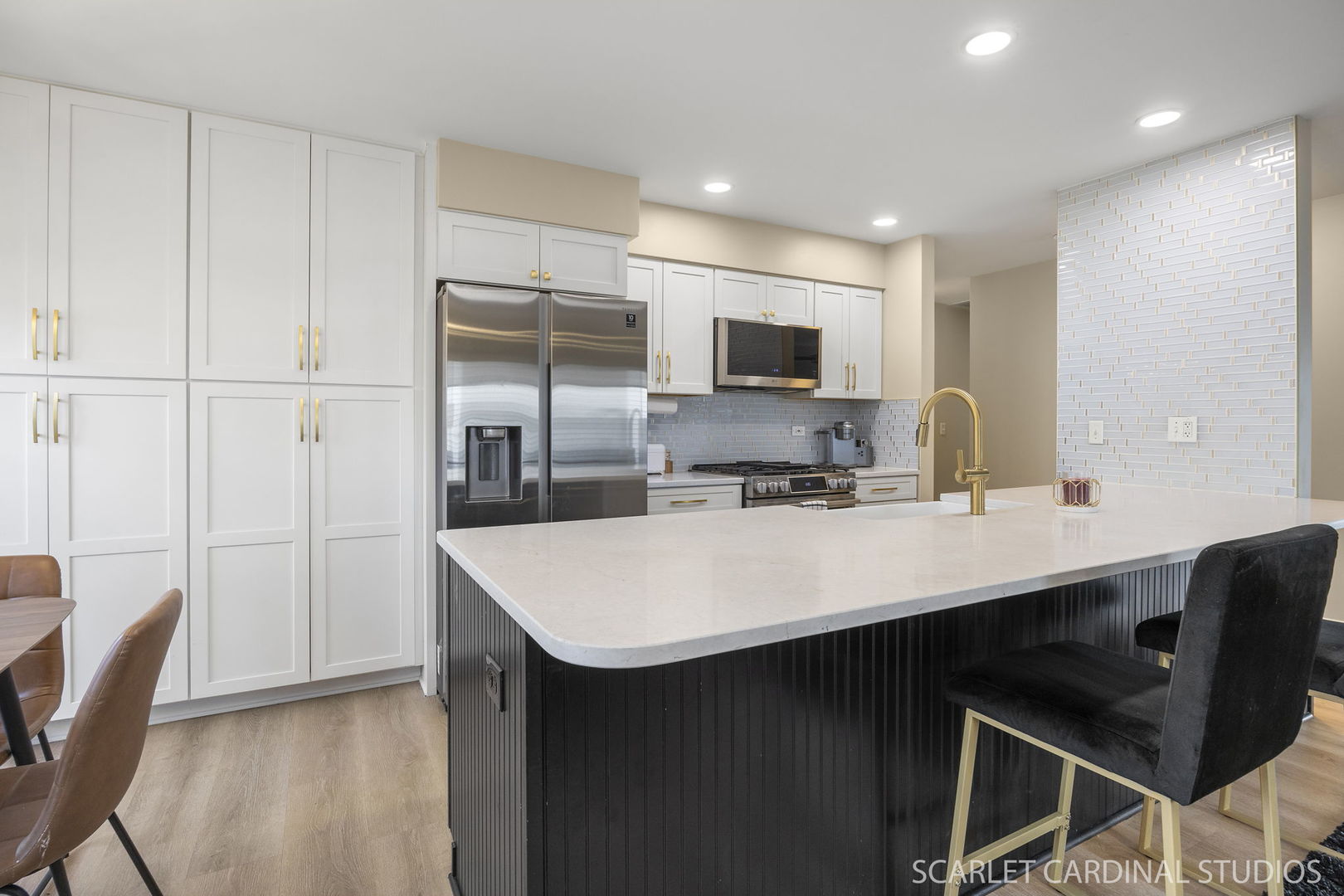 2828 Bluewater Circle Naperville, IL 60564 - Photo 7 of 17 a kitchen with kitchen island a sink appliances and a counter top space